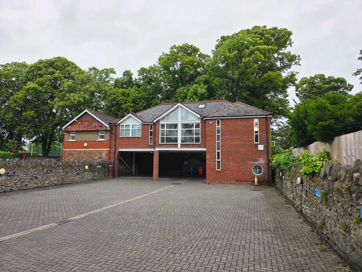 Exterior of IronOx Clinic, Cathedral Road, Cardiff — brick building with on-site parking